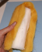 Placing wool on foam tube
